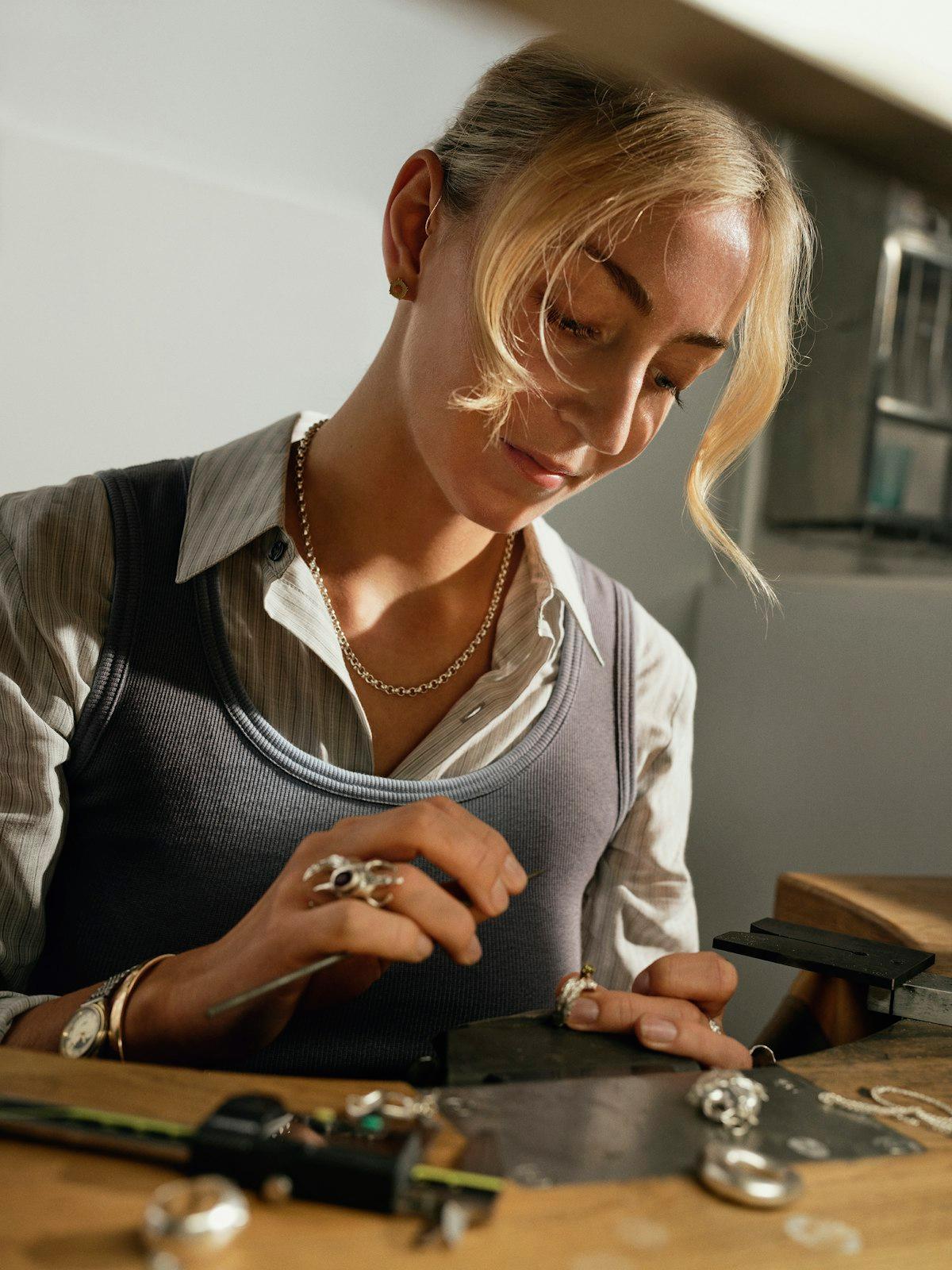 Hands at the jeweller's bench, mid-work